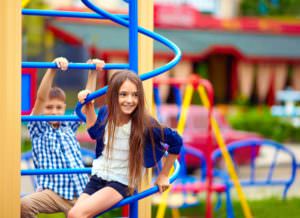 children playing on a playground on a hot day